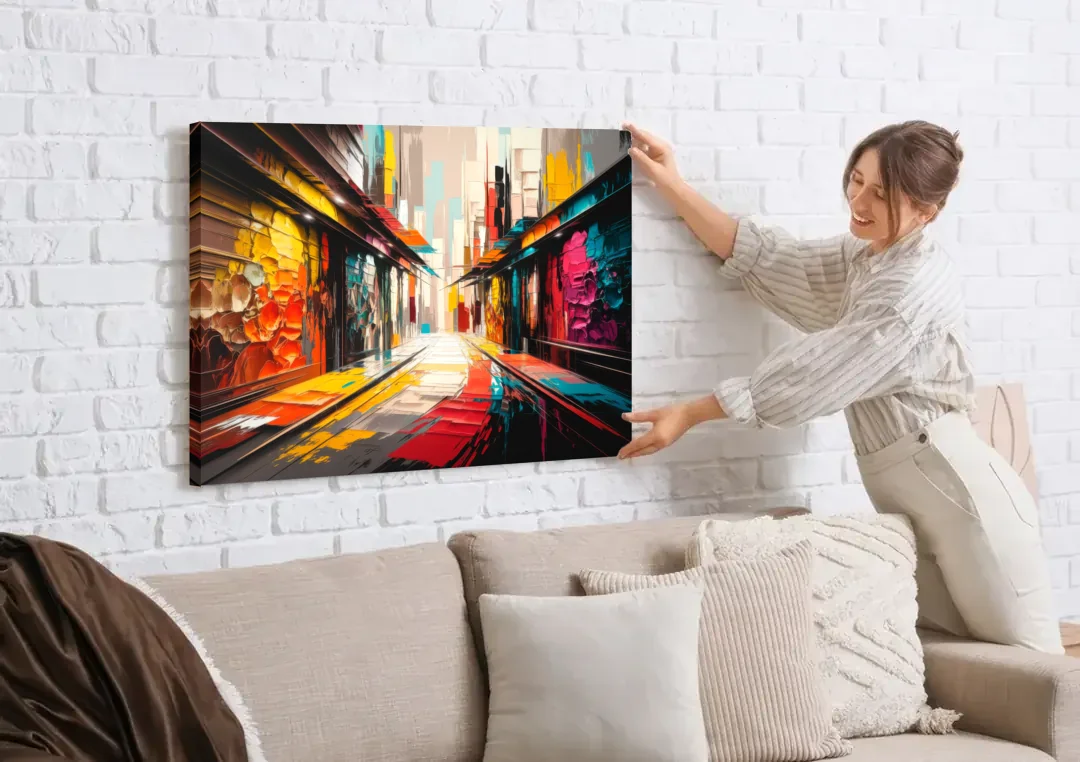 Ashland Street Art Vibes canvas wall art being hung on a white brick wall above a sofa