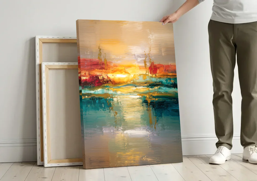 Ashland Sunset Horizon canvas wall art leaning against a wall next to blank canvases