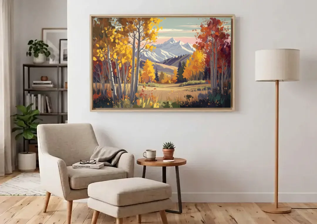 Aspen Majestic Landscape canvas wall art above an armchair in a bright living room