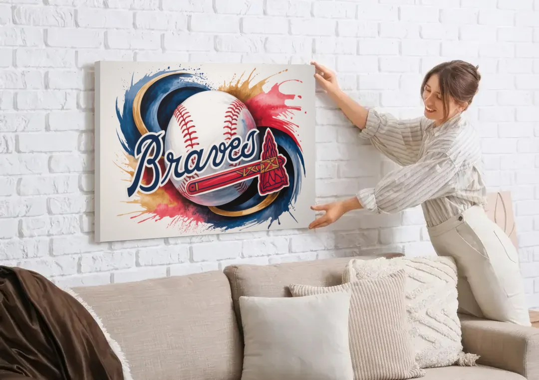 Atlanta Braves Abstract Watercolor Artwork with Iconic Motifs canvas wall art being hung on a white brick wall above a sofa