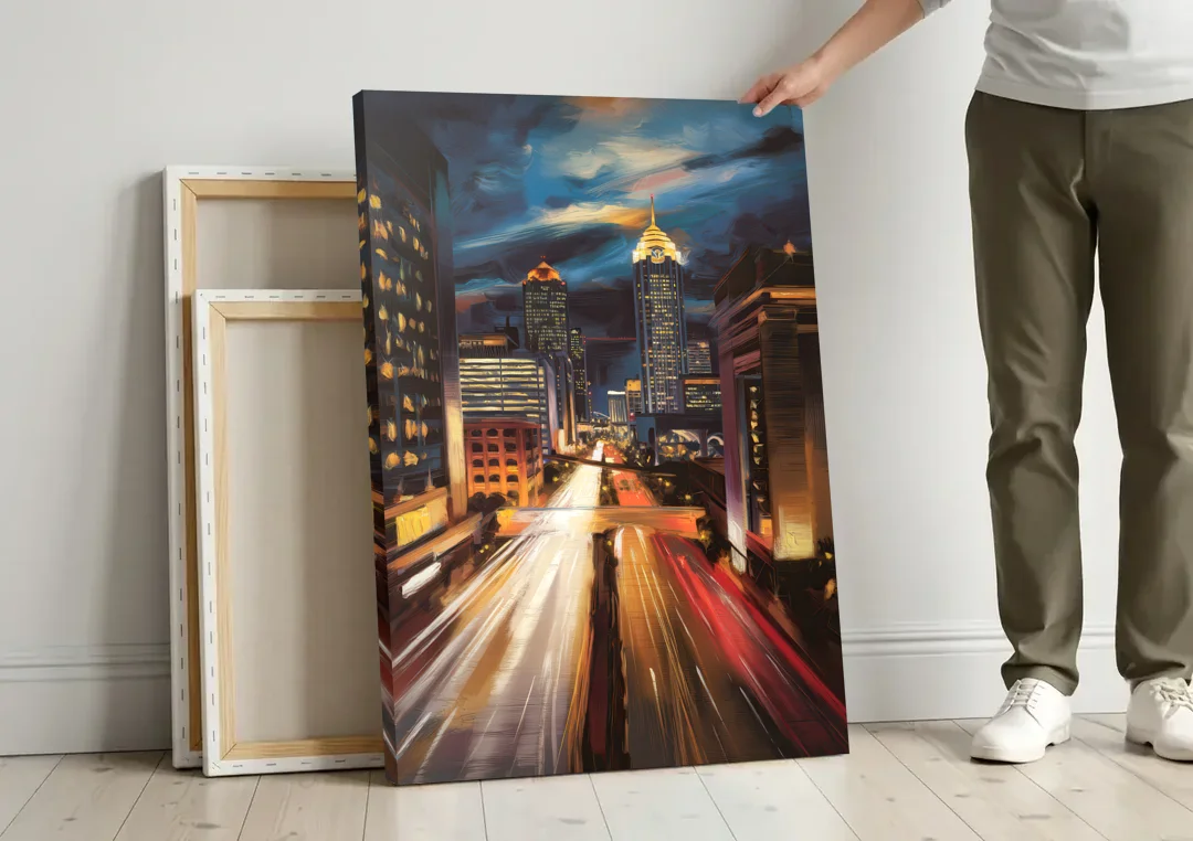 Atlanta Cityscape at Night canvas wall art leaning against a wall next to blank canvases