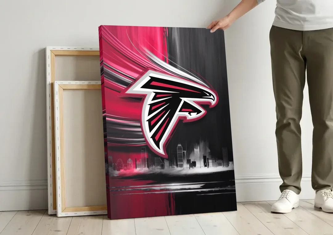 Atlanta Falcons Fans Tribute canvas wall art leaning against a wall next to blank canvases