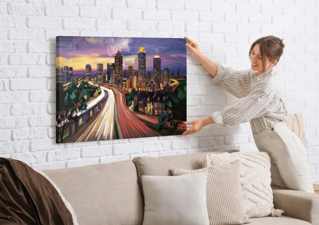 Atlanta Historic Neighborhoods canvas wall art being hung on a white brick wall above a sofa