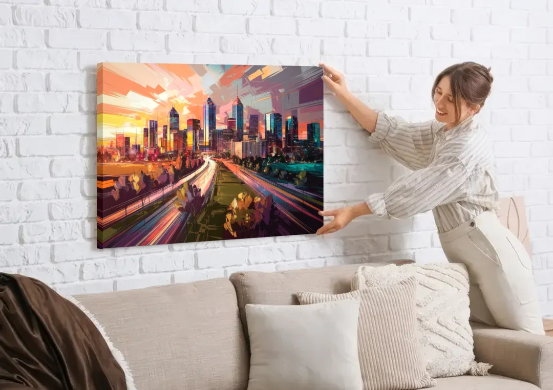 Atlanta Midtown Skyline canvas wall art being hung on a white brick wall above a sofa