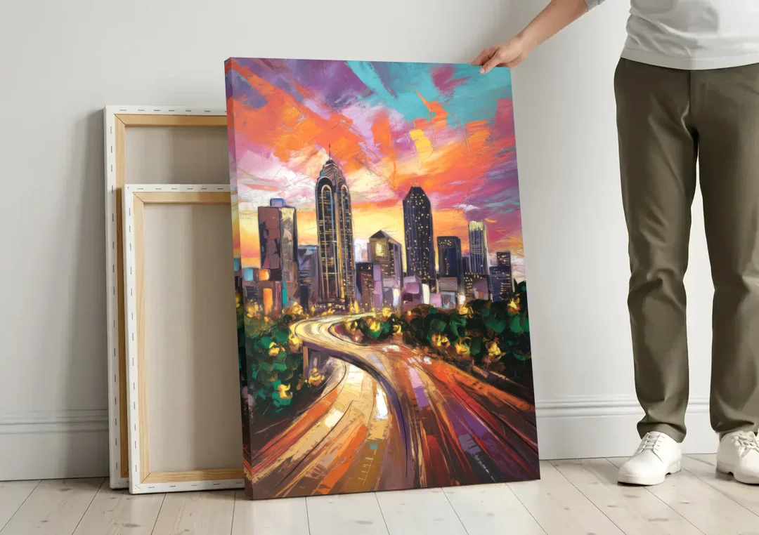 Atlanta Skyline at Sunset canvas wall art leaning against a wall next to blank canvases