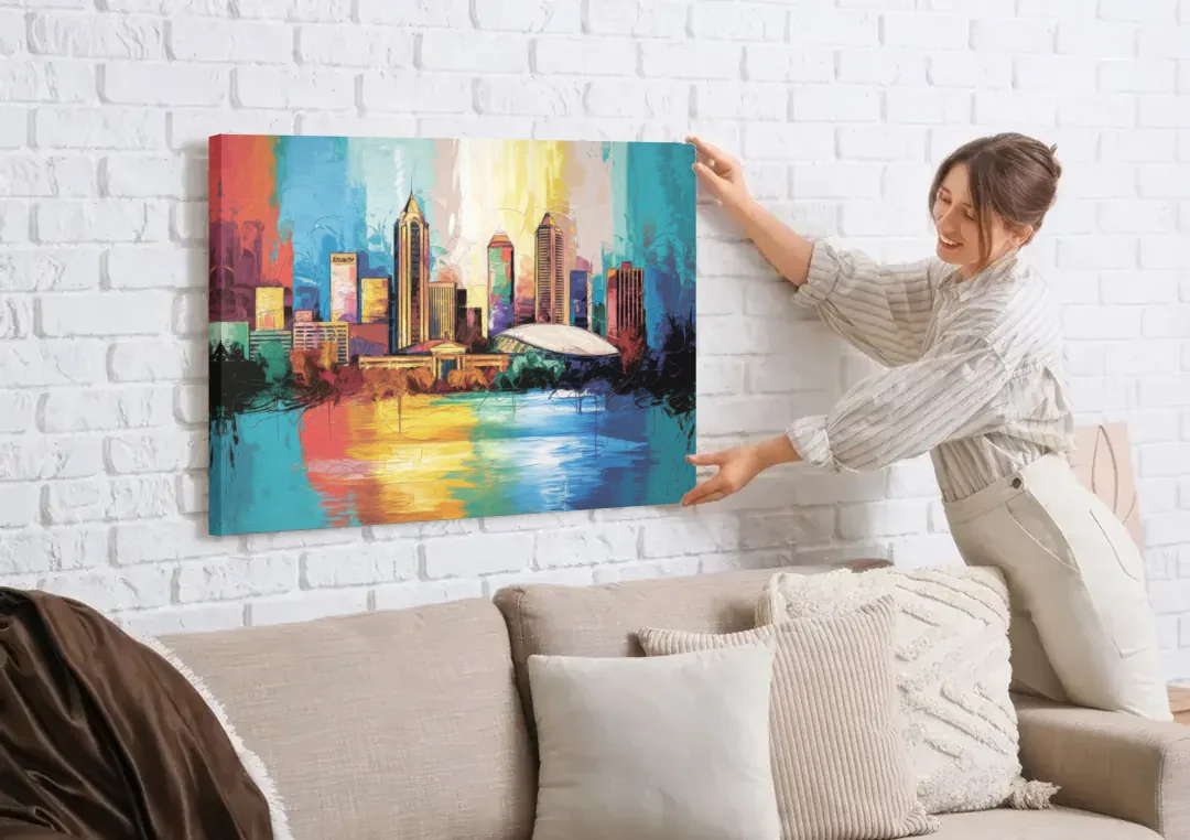 Atlanta Skyline Panoramic View canvas wall art being hung on a white brick wall above a sofa