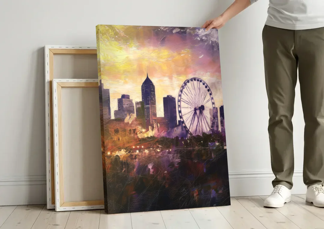 Atlanta Skyline with Ferris Wheel canvas wall art leaning against a wall next to blank canvases