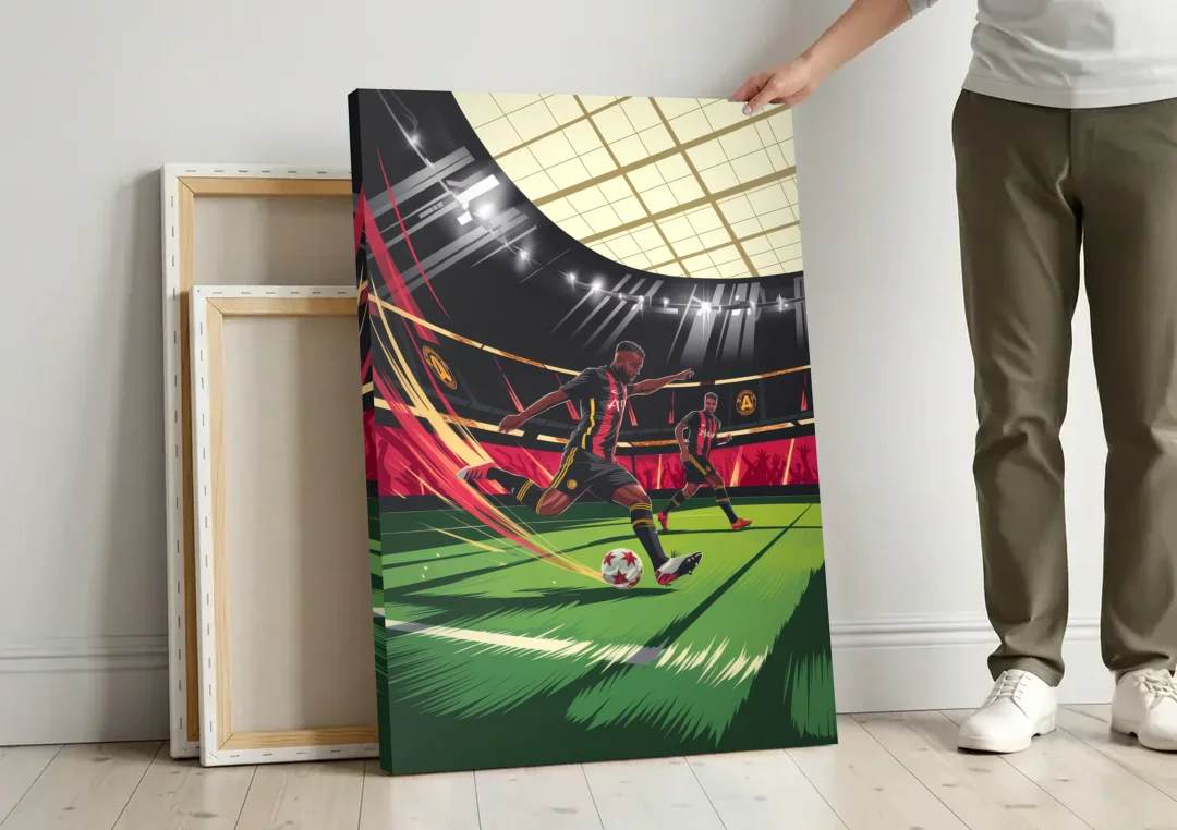Atlanta United Soccer Action canvas wall art leaning against a wall next to blank canvases