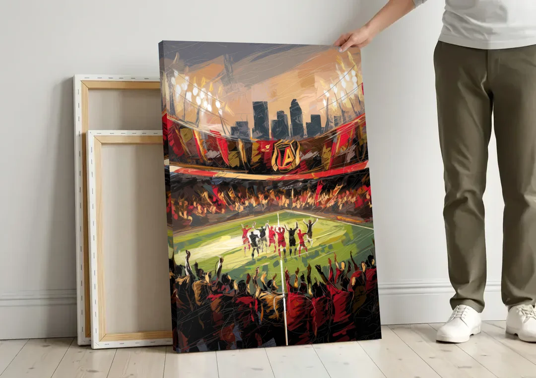 Atlanta United Team Celebration canvas wall art leaning against a wall next to blank canvases