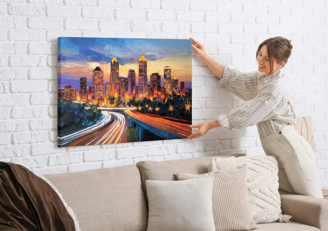 Atlanta Vibrant Downtown Scene canvas wall art being hung on a white brick wall above a sofa