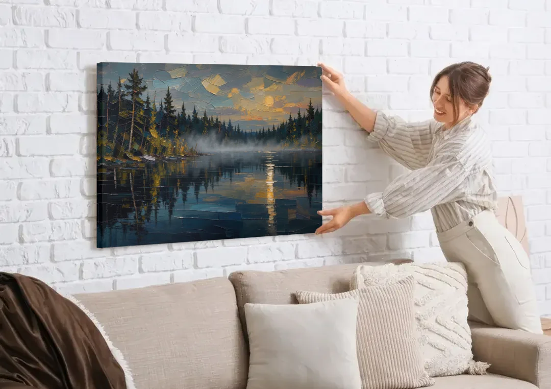 Atmospheric Landscape Painting of a Fogbound Lake canvas wall art being hung on a white brick wall above a sofa