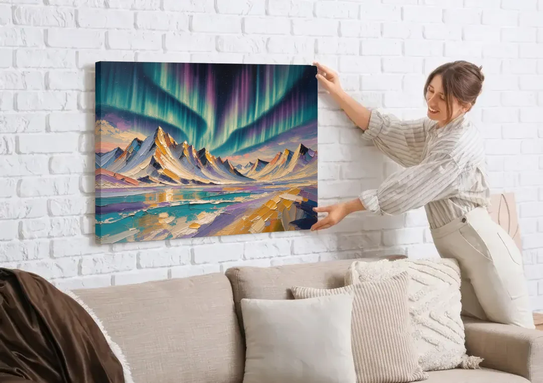 Aurora Borealis Painting Over Jagged Peaks canvas wall art being hung on a white brick wall above a sofa