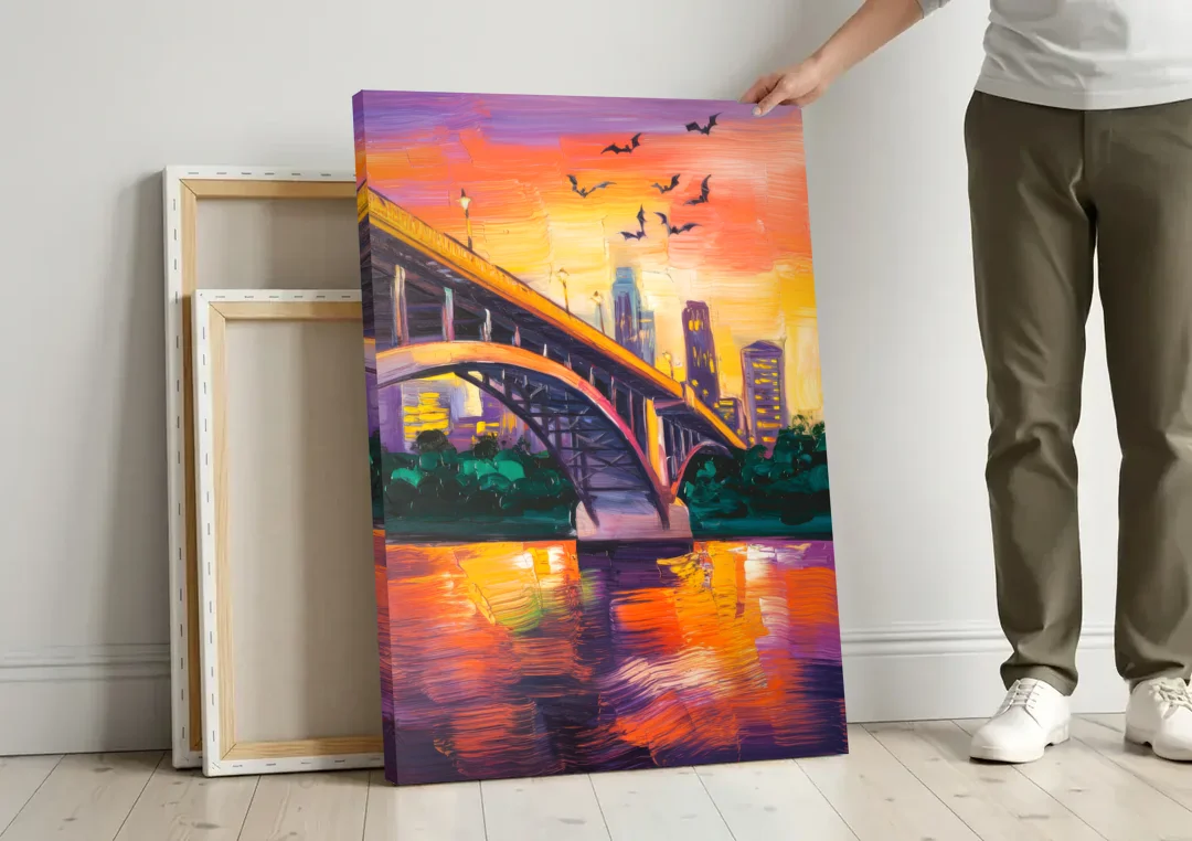 Austin Congress Avenue Bridge canvas wall art leaning against a wall next to blank canvases