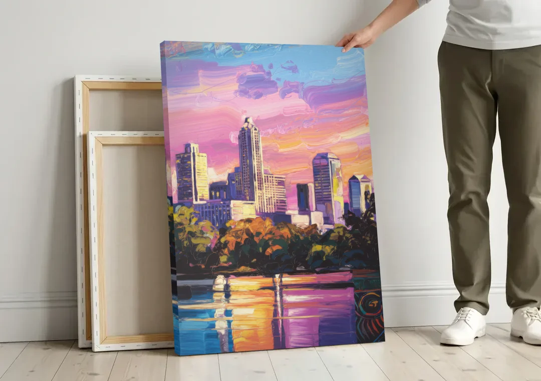 Austin East Side Murals canvas wall art leaning against a wall next to blank canvases