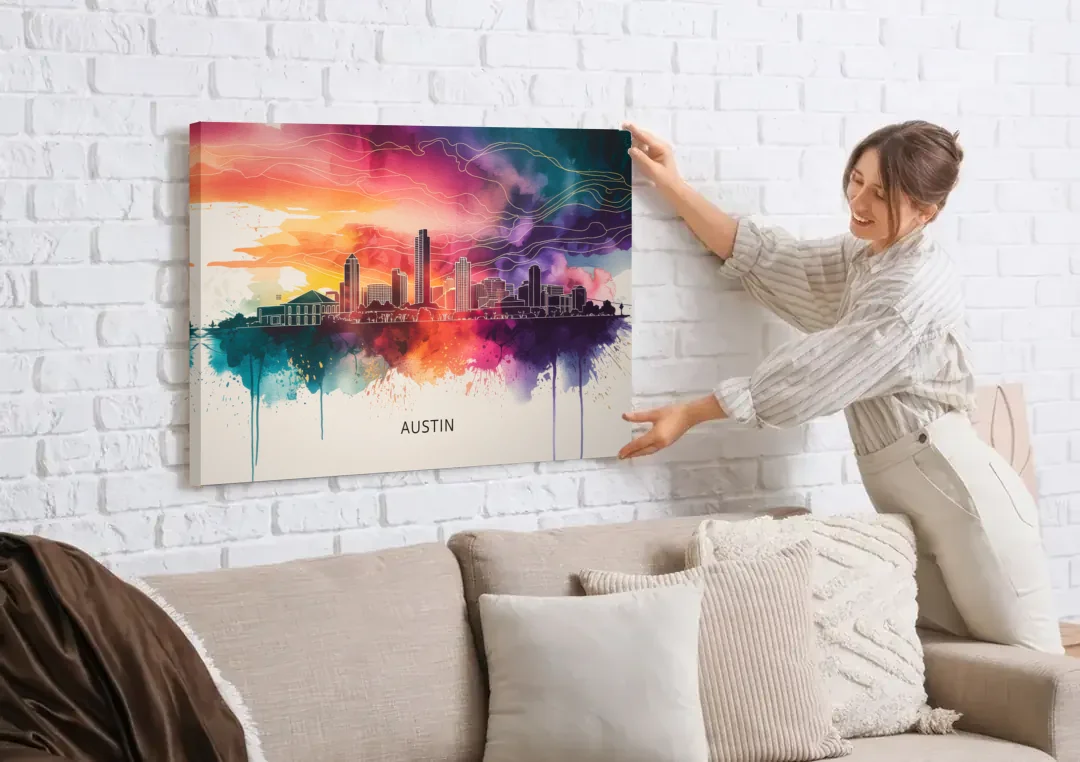 Austin Skyline Sunset Art canvas wall art being hung on a white brick wall above a sofa