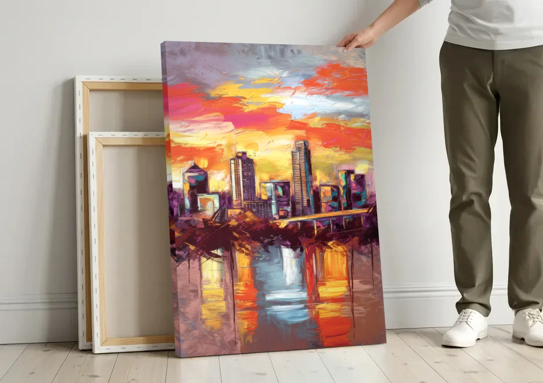 Austin Sunset Over Skyline canvas wall art leaning against a wall next to blank canvases