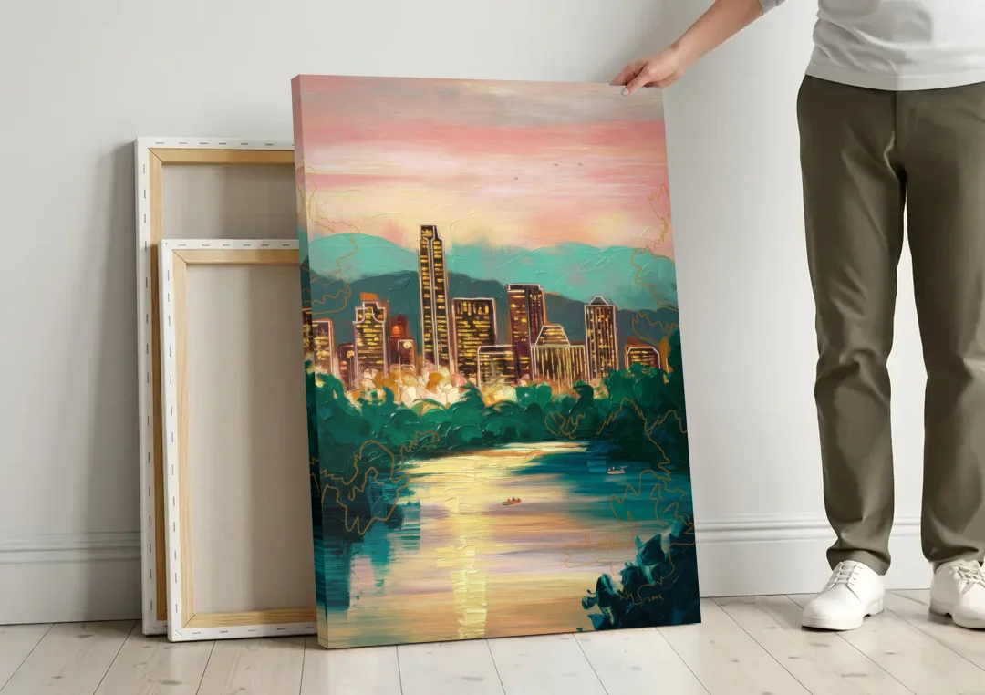 Austin Westlake Hills View canvas wall art leaning against a wall next to blank canvases
