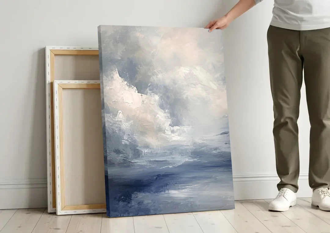 Azure Veil I canvas wall art leaning against a wall next to blank canvases