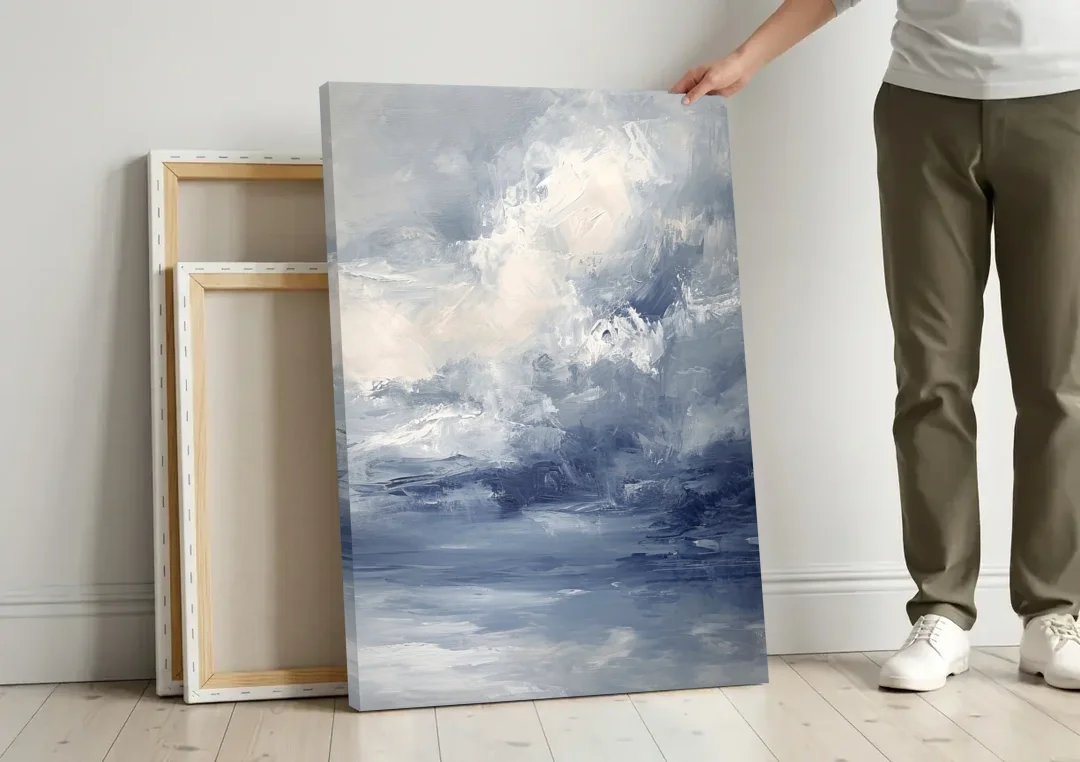 Azure Veil II canvas wall art leaning against a wall next to blank canvases