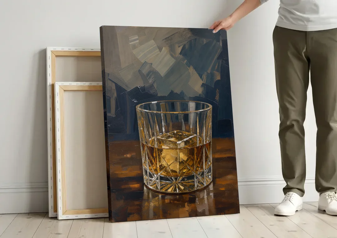 Bachelor Pad Wall Art Whiskey on the Rocks canvas wall art leaning against a wall next to blank canvases