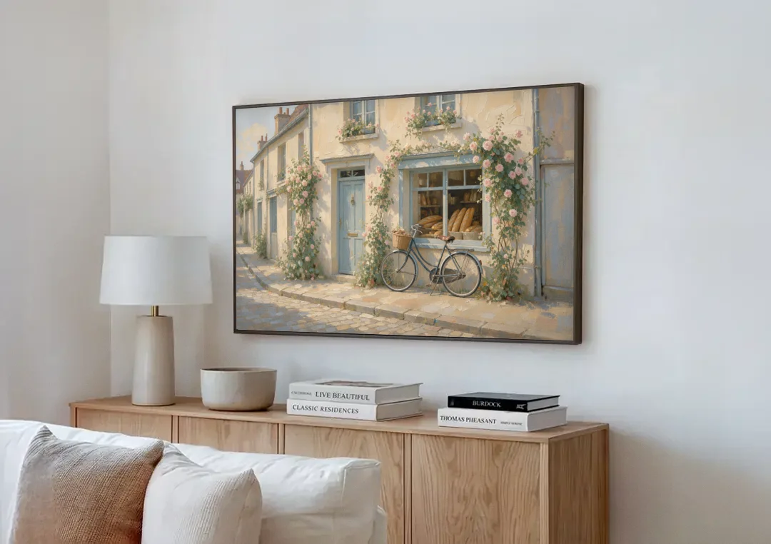 Bakery Painting with Roses and Vintage Bicycle canvas wall art above a wooden sideboard next to a sofa