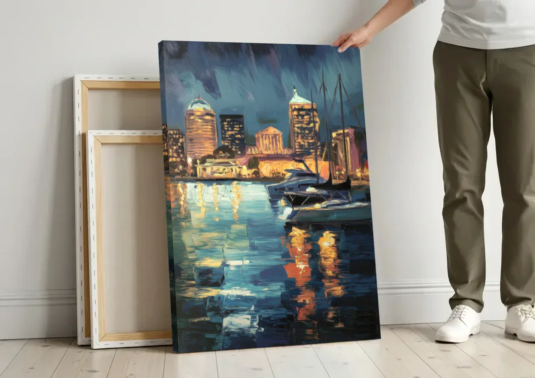 Baltimore Harbor Nightscape canvas wall art leaning against a wall next to blank canvases