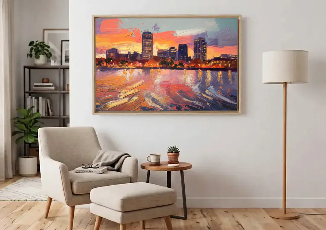 Baltimore Inner Harbor Sunset canvas wall art above an armchair in a bright living room