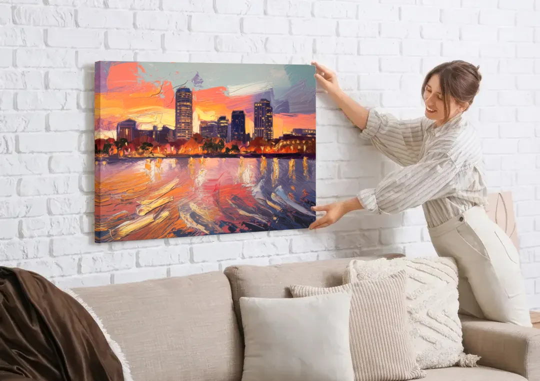 Baltimore Inner Harbor Sunset canvas wall art being hung on a white brick wall above a sofa