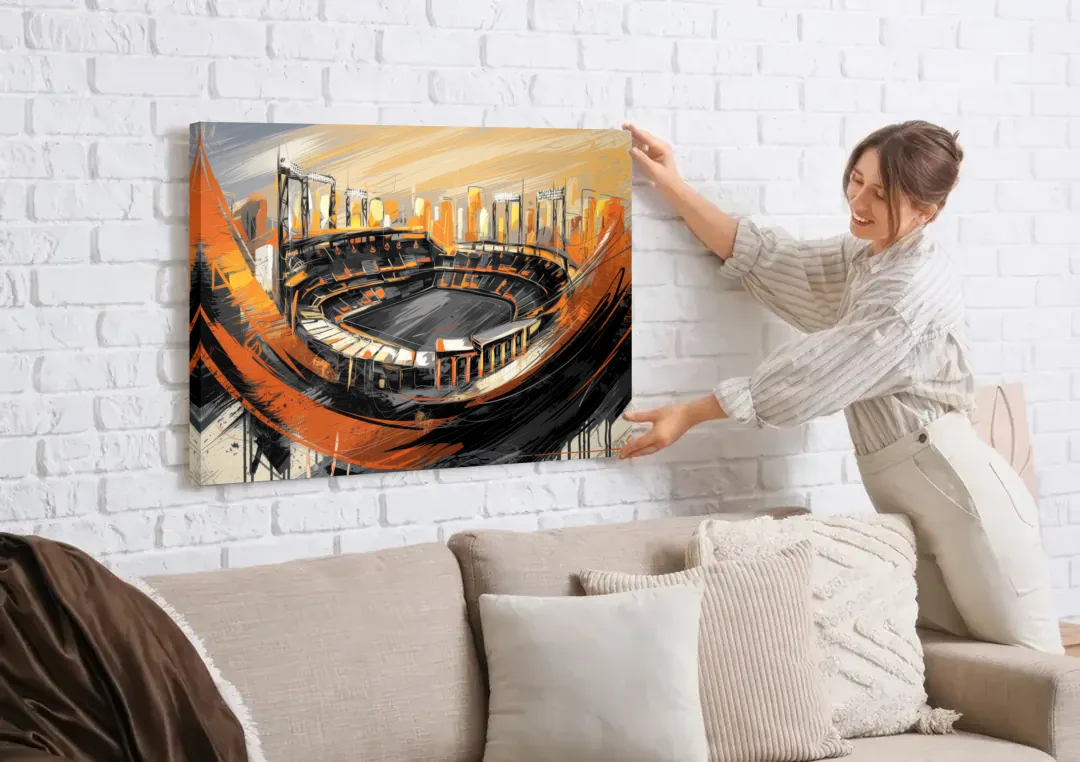 Baltimore Orioles Team Spirit canvas wall art being hung on a white brick wall above a sofa