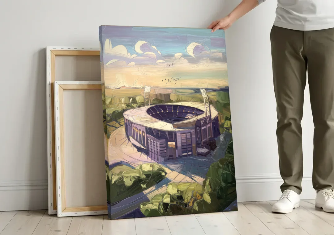 Baltimore Ravens Stadium View canvas wall art leaning against a wall next to blank canvases