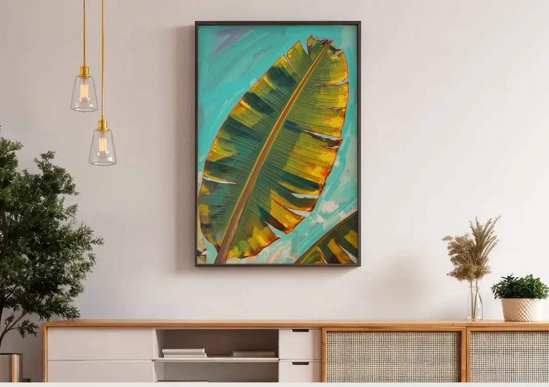 Banana Leaf Wall Art in Golden Backlight canvas wall art above a wooden sideboard under pendant lights