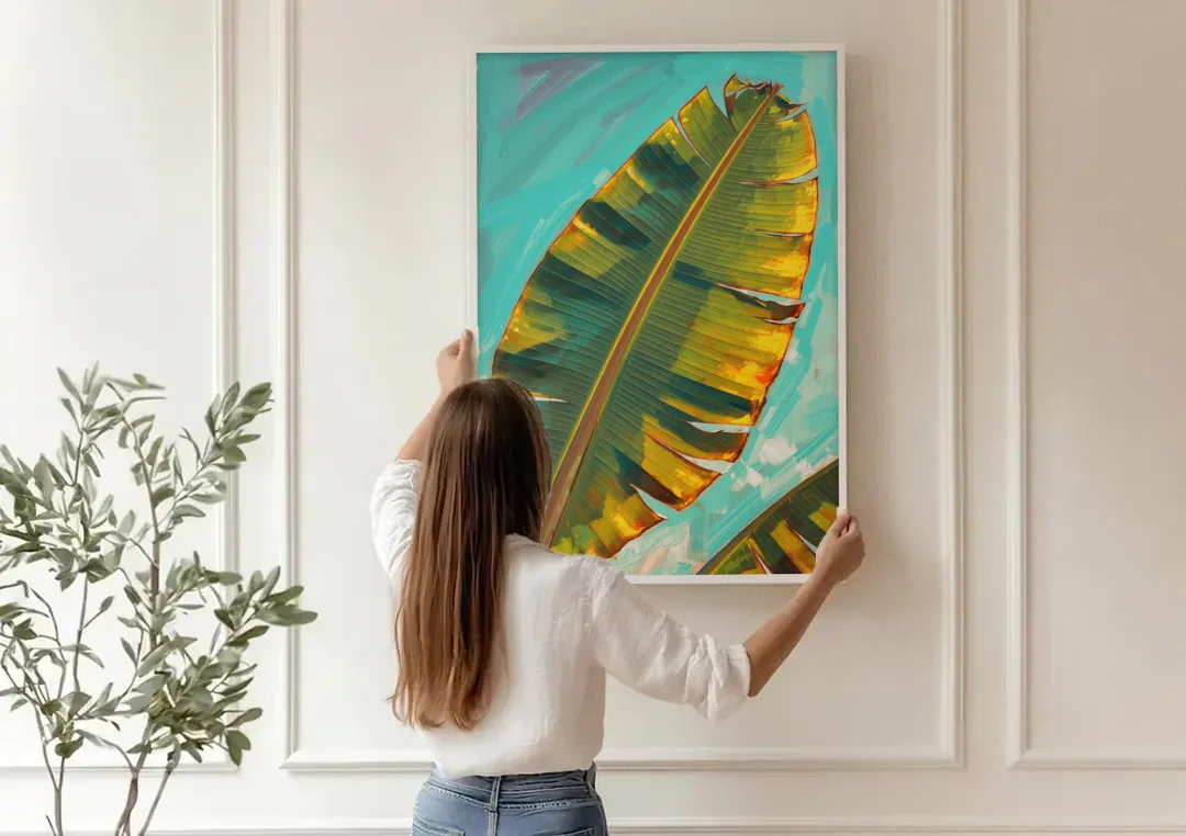 Banana Leaf Wall Art in Golden Backlight canvas wall art being hung on a paneled wall