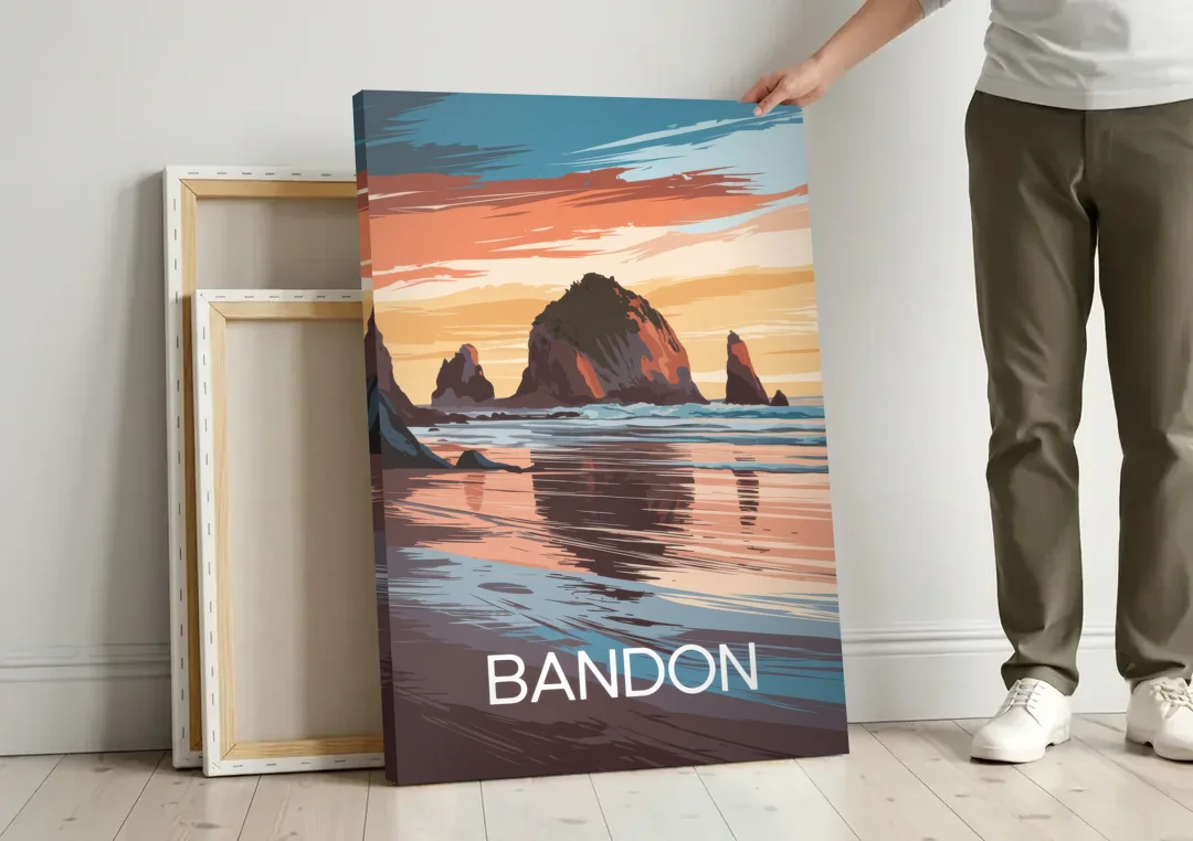 Bandon Coastal Sunset canvas wall art leaning against a wall next to blank canvases