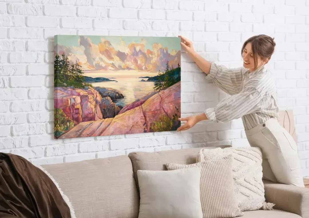 Bar Harbor Sunrise Over Acadia canvas wall art being hung on a white brick wall above a sofa