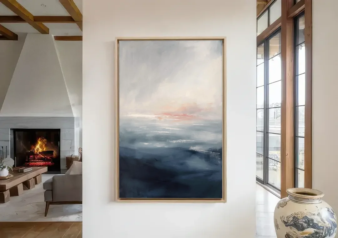 Bathroom Paintings Blush Dawn Over a Misty Sea canvas wall art in a living room with a fireplace