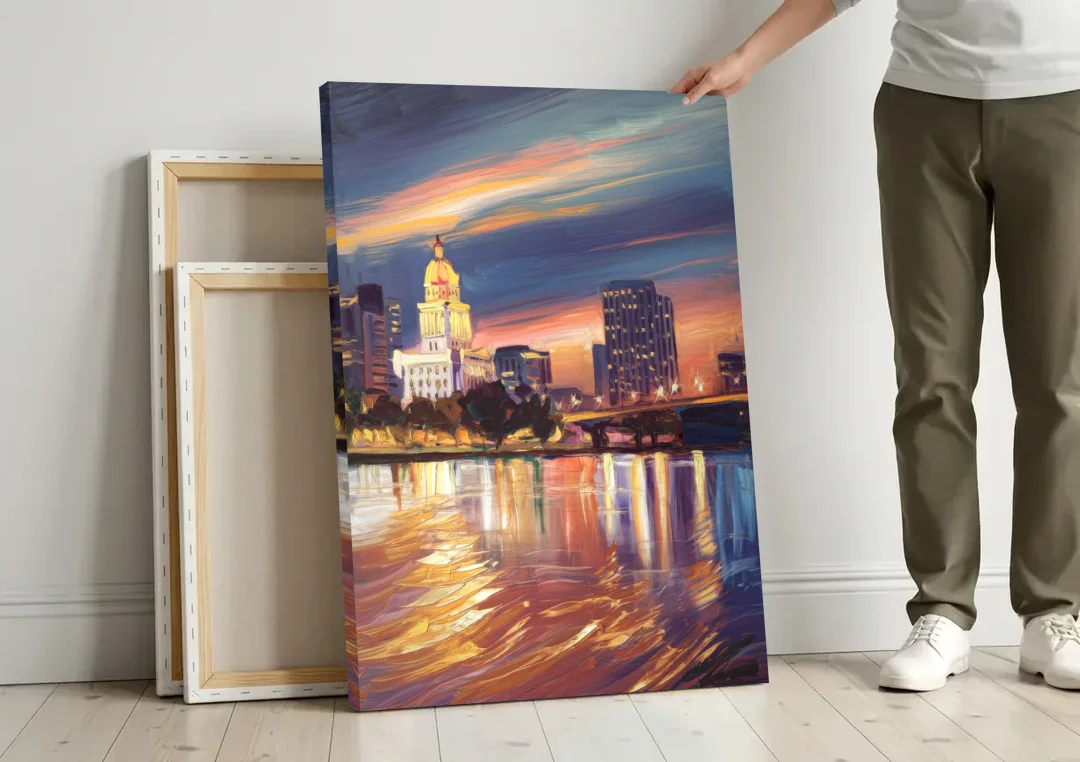 Baton Rouge Cityscape Twilight canvas wall art leaning against a wall next to blank canvases