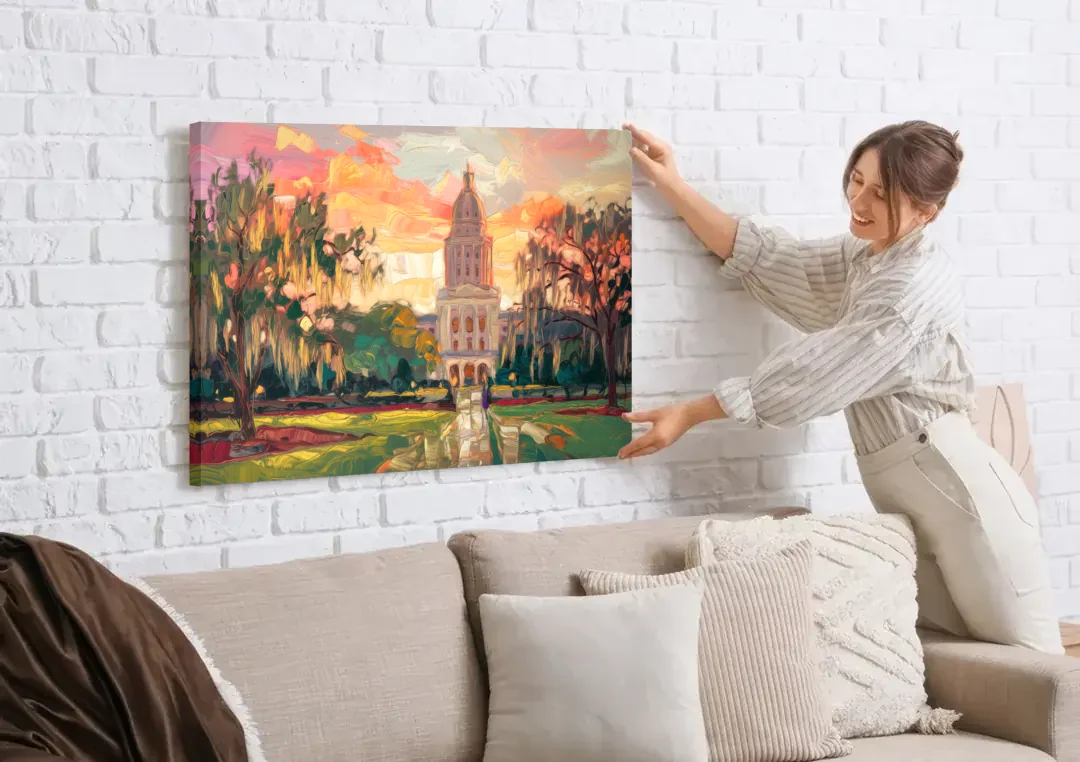 Baton Rouge Louisiana State Capitol canvas wall art being hung on a white brick wall above a sofa