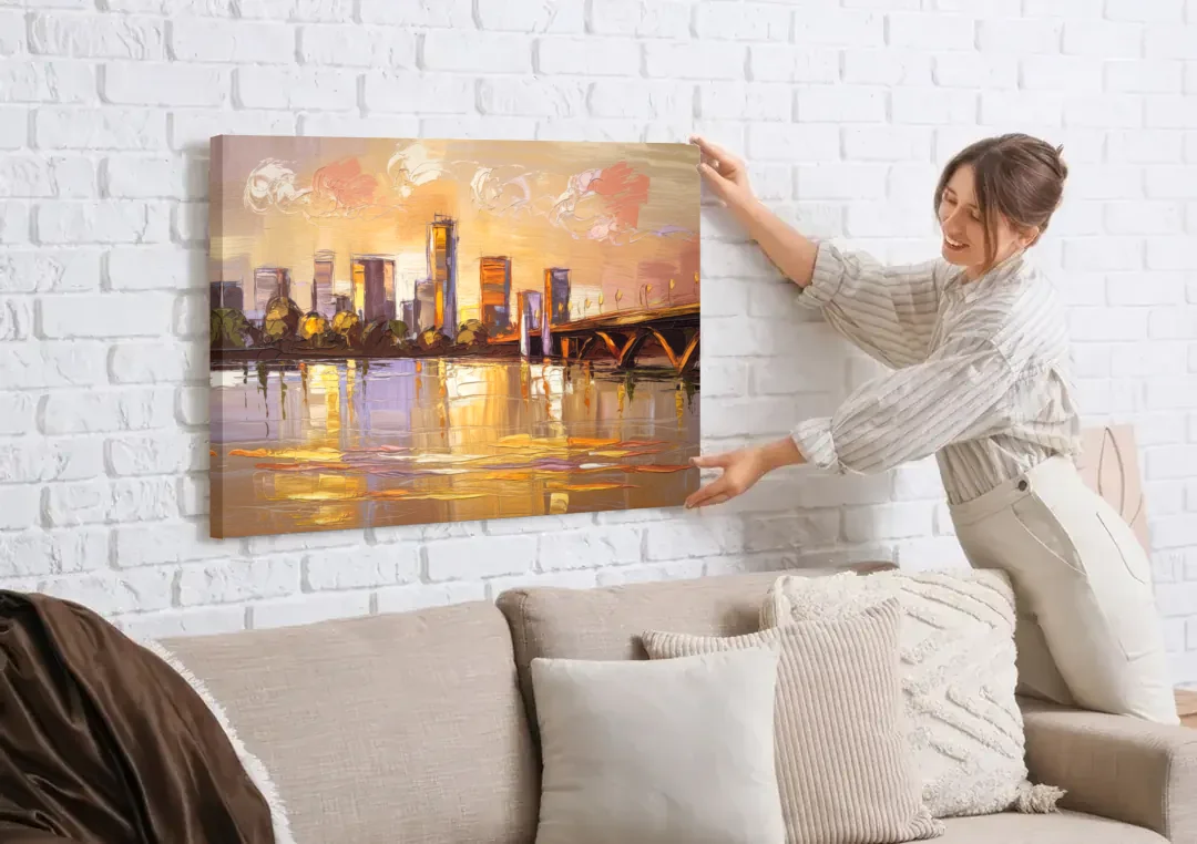 Baton Rouge Mississippi River View canvas wall art being hung on a white brick wall above a sofa