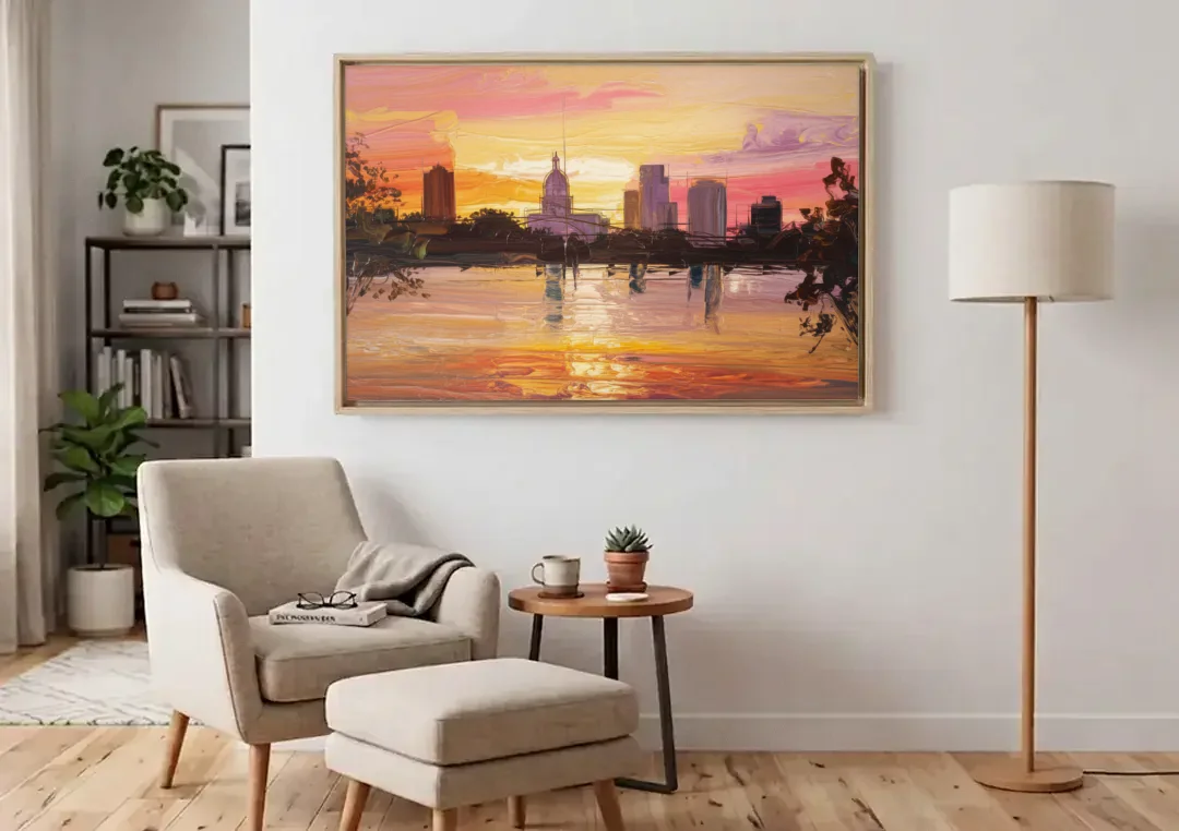 Baton Rouge Skyline Sunset canvas wall art above an armchair in a bright living room