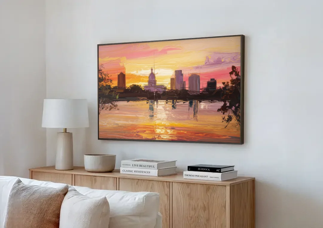 Baton Rouge Skyline Sunset canvas wall art above a wooden sideboard next to a sofa