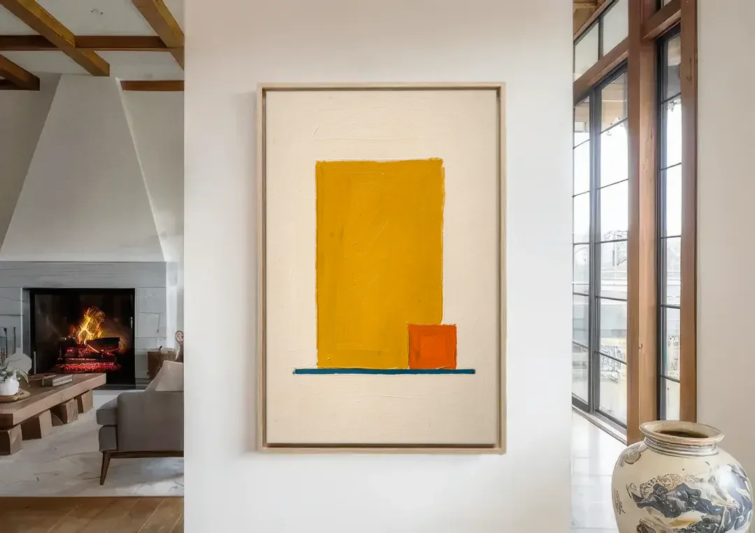 Bauhaus Wall Art with Yellow Block and Orange Square canvas wall art in a living room with a fireplace