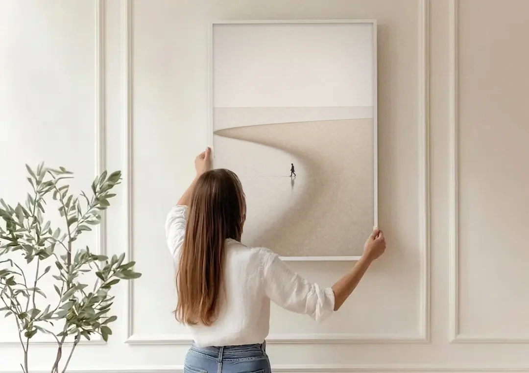 Beach Minimalist Art of a Lone Walker canvas wall art being hung on a paneled wall