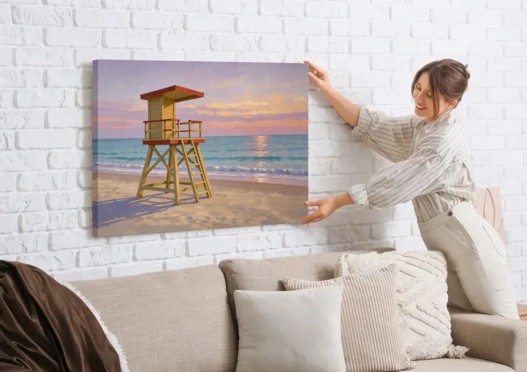 Beach Wall Art for Living Room with Lifeguard Stand canvas wall art being hung on a white brick wall above a sofa