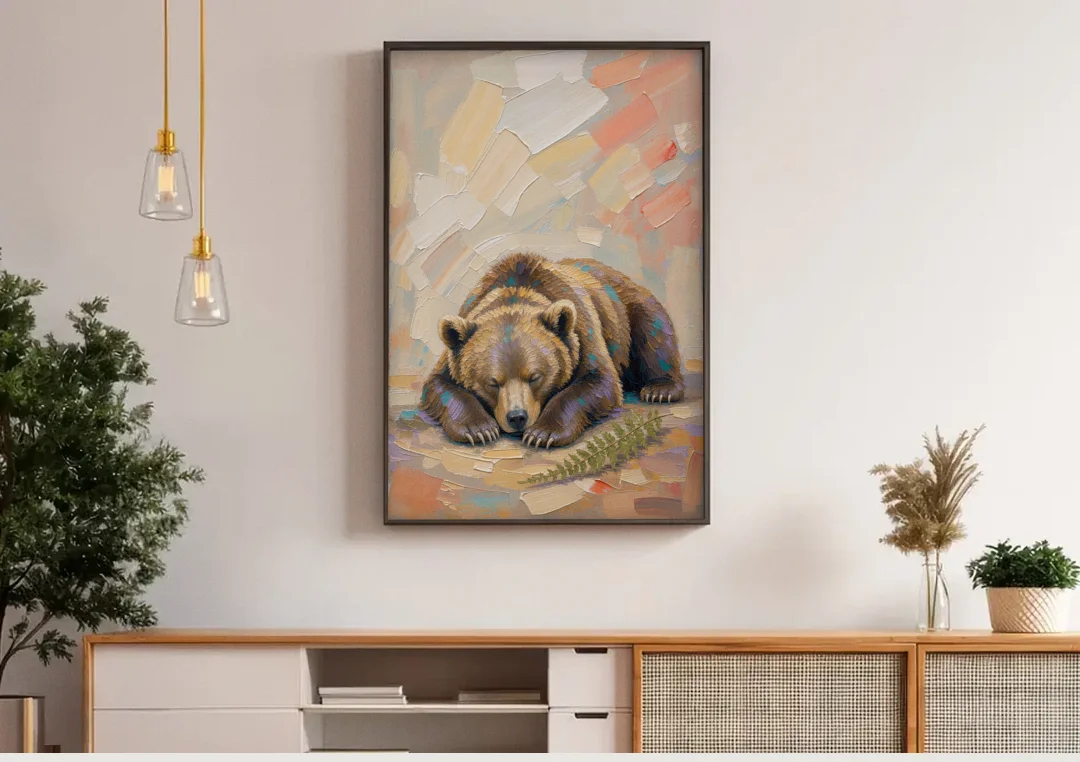 Bear Cub Painting Asleep on Its Paws canvas wall art above a wooden sideboard under pendant lights