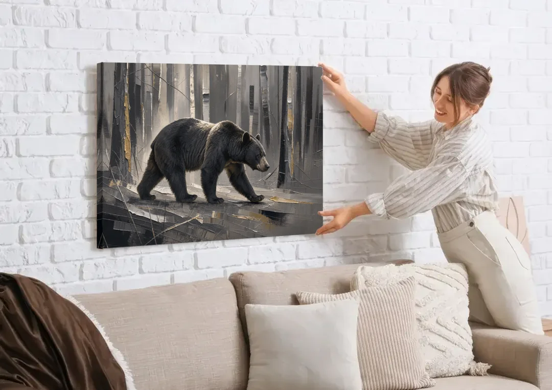 Bear Walking Through the Silver Woods canvas wall art being hung on a white brick wall above a sofa