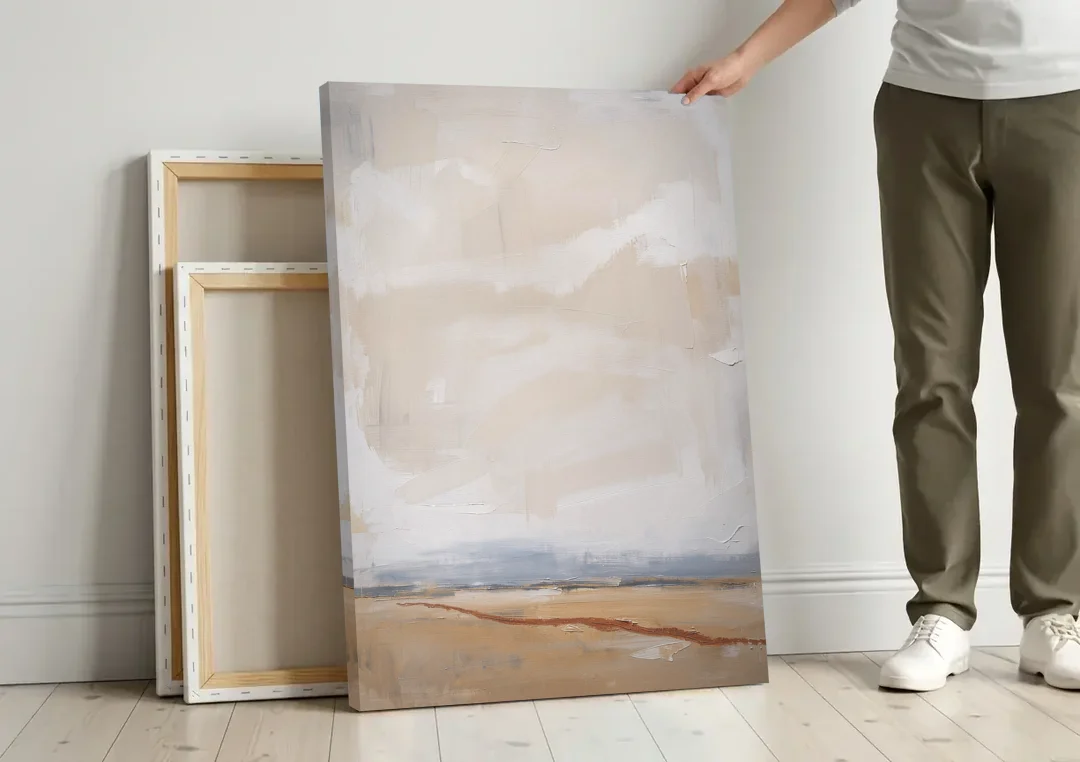 Bedroom Abstract Wall Art of Ochre Field canvas wall art leaning against a wall next to blank canvases