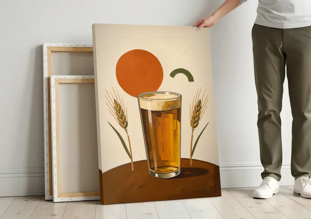 Beer Art Amber Pint with Barley Stems canvas wall art leaning against a wall next to blank canvases
