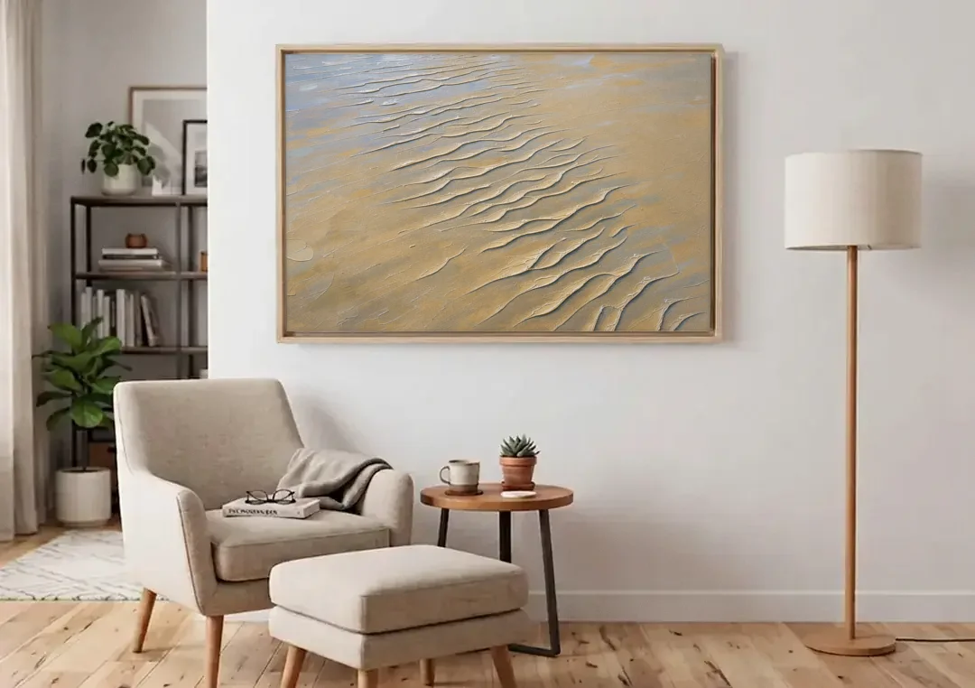 Beige Textured Wall Art of Rippled Tidal Sand canvas wall art above an armchair in a bright living room