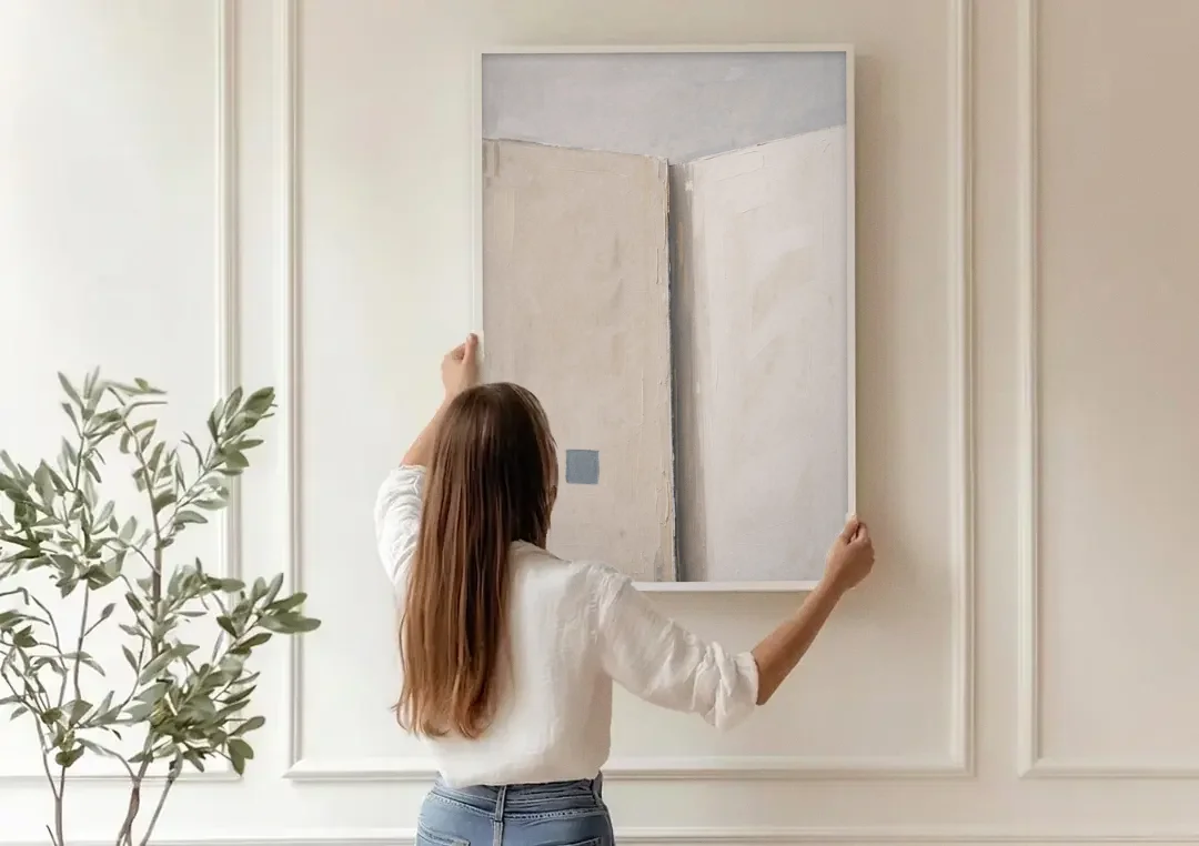 Beige Wall Art Fold with Slate Square canvas wall art being hung on a paneled wall