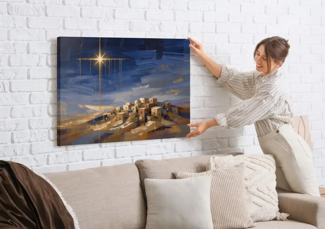 Bethlehem Painting with Sleeping Hilltop Town canvas wall art being hung on a white brick wall above a sofa